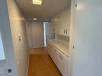 Hallway with linen cabinets